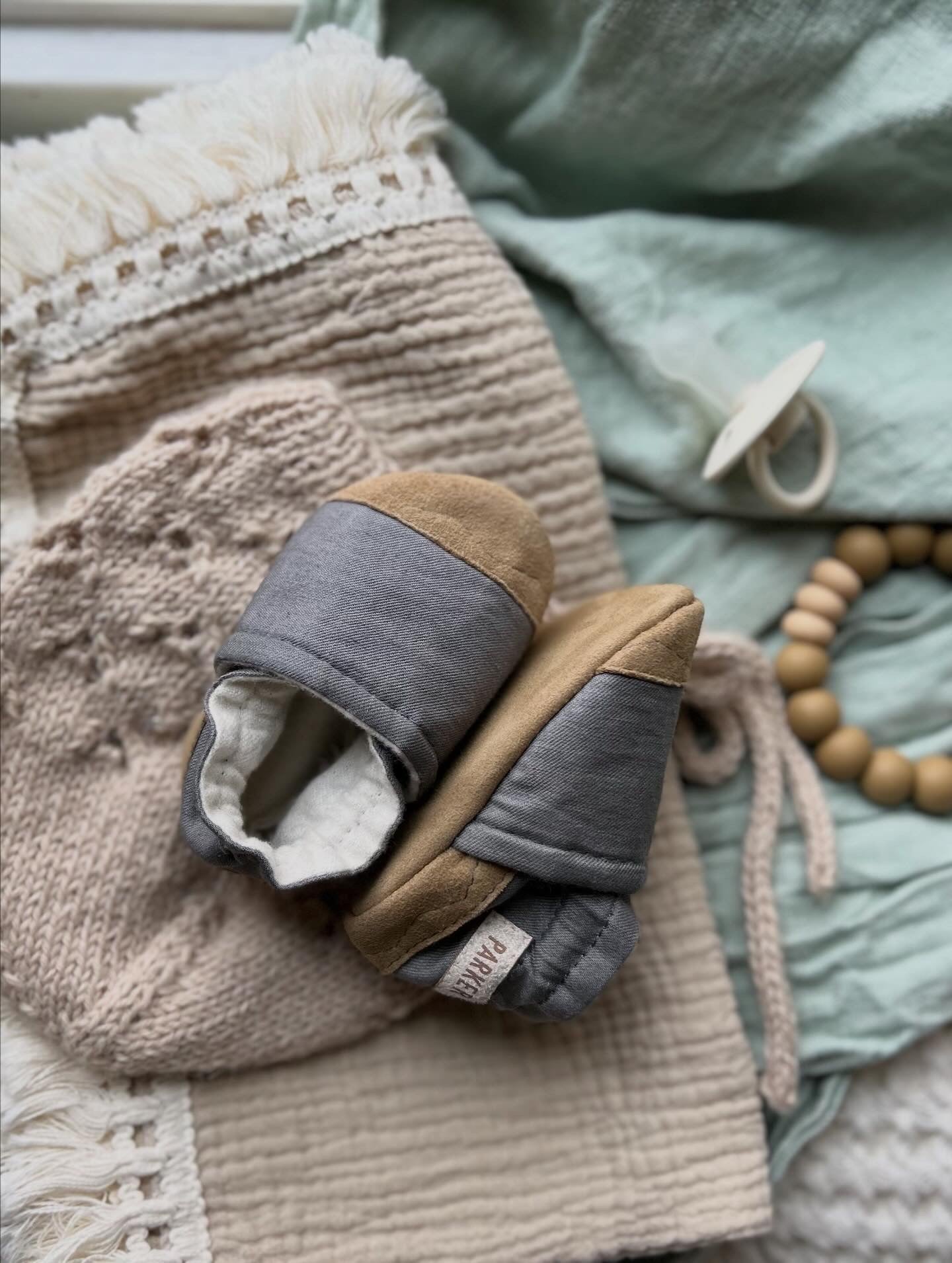 dark grey soft soled baby shoe